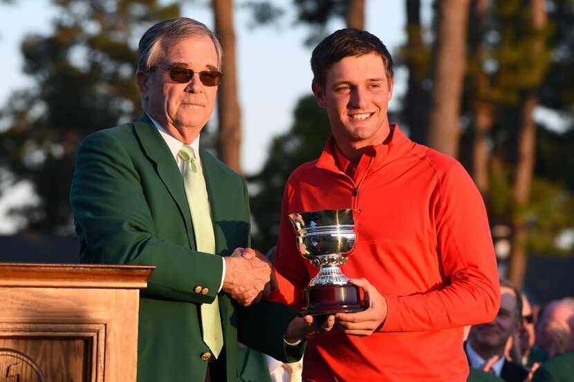 AUGUSTA, GEORGIA - APRIL 10:  Amateur Bryson DeChambeau of the United States celebrates with...