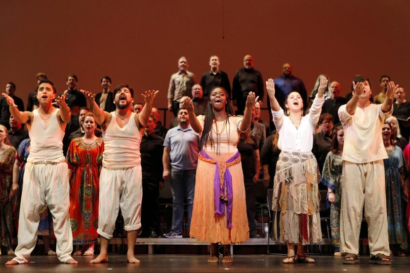 
Feleceia Benton stars as Aida, center, with cast, act out a scene in Aida at Dallas City...