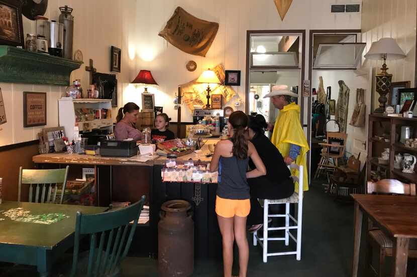 Customers gather at The Shop Downtown in Schulenburg, Texas, where Christine Heinrich, left,...