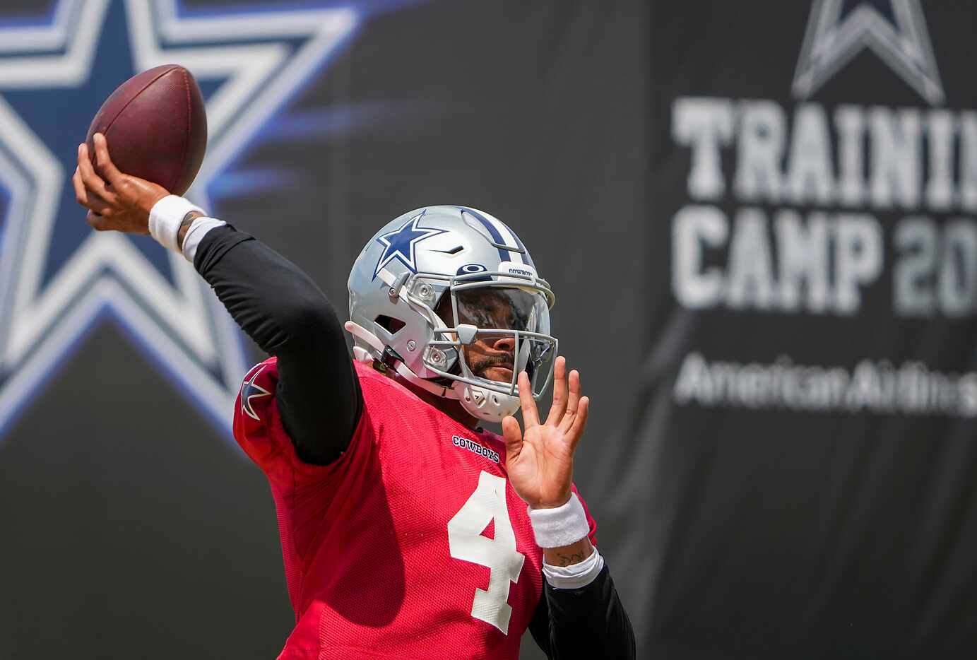 Dallas Cowboys quarterback Dak Prescott throws a pass in a drill during a practice at...
