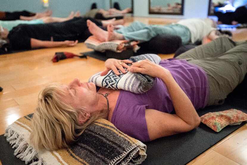 Karen Cangemi practices iRest, a guided meditation experience, during a trauma-sensitive...
