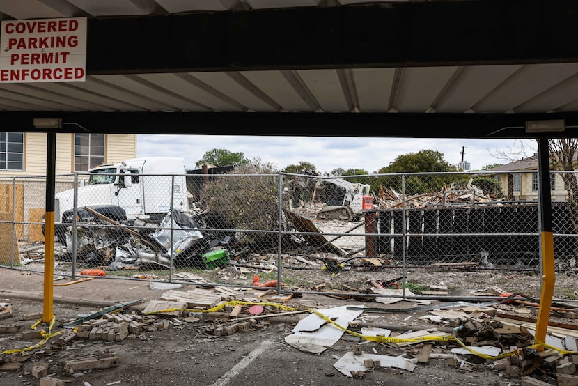 Debris removal work was ongoing in the apartment complex at 5700 Highland Hills in Dallas on...