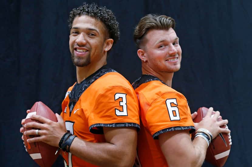 Oklahoma State quarterbacks Spencer Sanders, left, and Dru Brown, right, pose for a photo...
