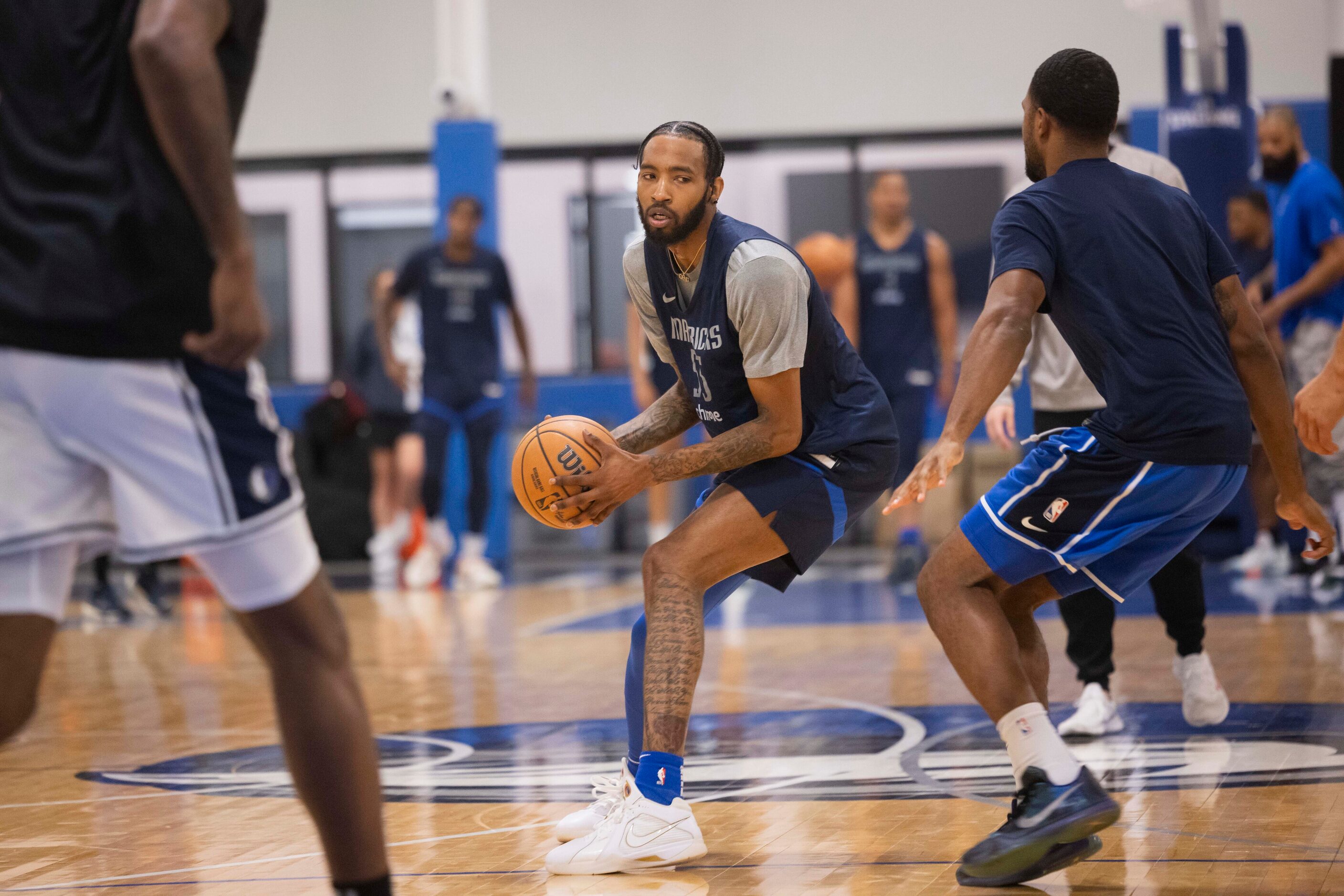 Dallas Mavericks forward Derrick Jones Jr. (55) practices with teammates at the Mavericks...