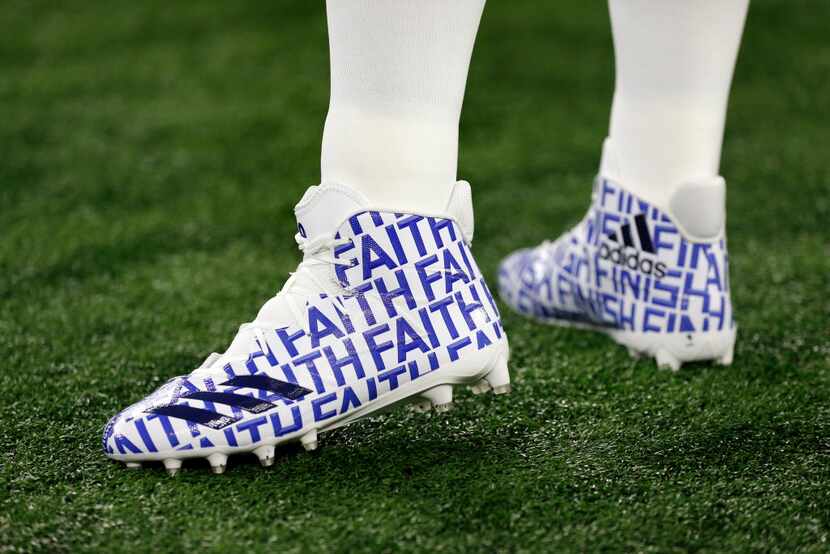 Dallas Cowboys quarterback Dak Prescott (4) wears a special pair of Adidas with the logo...