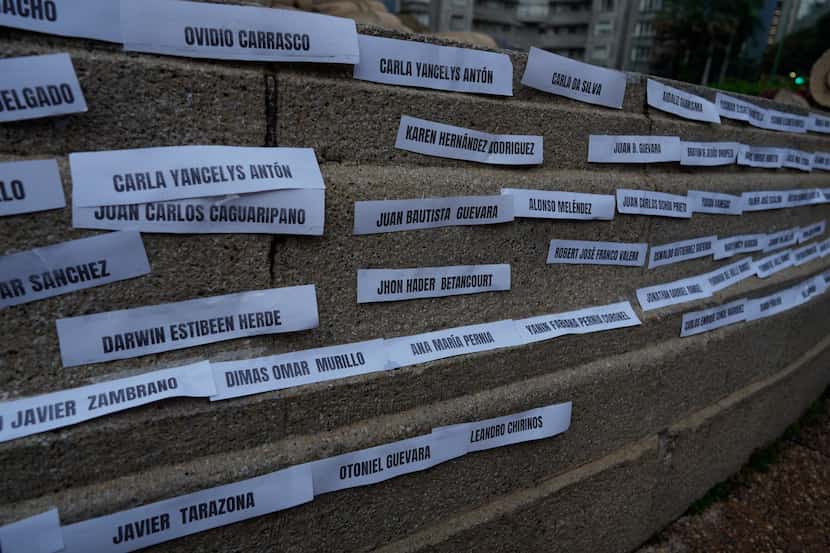 Names of political prisoners are displayed on a wall during a protest demanding the freedom...