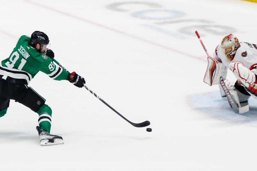 Dallas Stars center Tyler Seguin (91) scores a goal past Ottawa Senators goaltender Anton...