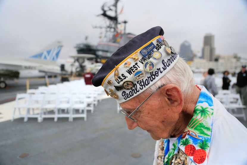 World War II veteran Stuart Hedley displays his badges at a Wreath Remembrance Ceremony...