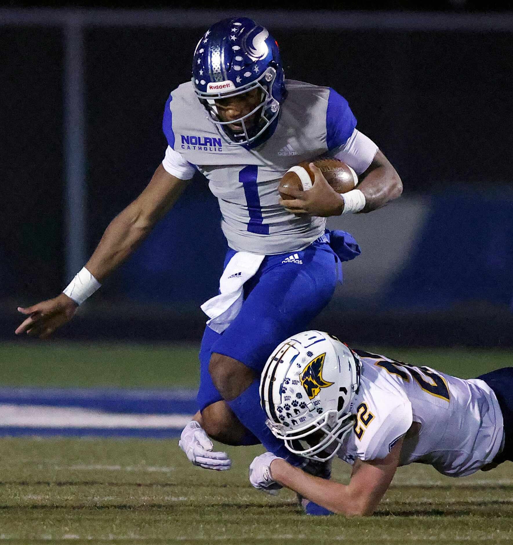 Plano Prestonwood Christian Academy's Jake Franklin tackles Fort Worth Nolan TJ Williams (1)...