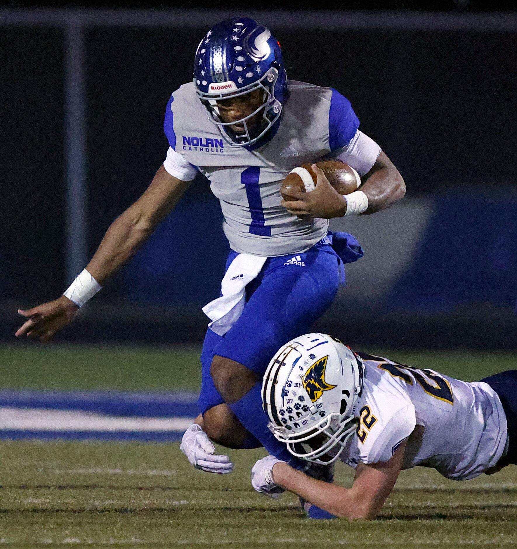 Plano Prestonwood Christian Academy's Jake Franklin tackles Fort Worth Nolan TJ Williams (1)...