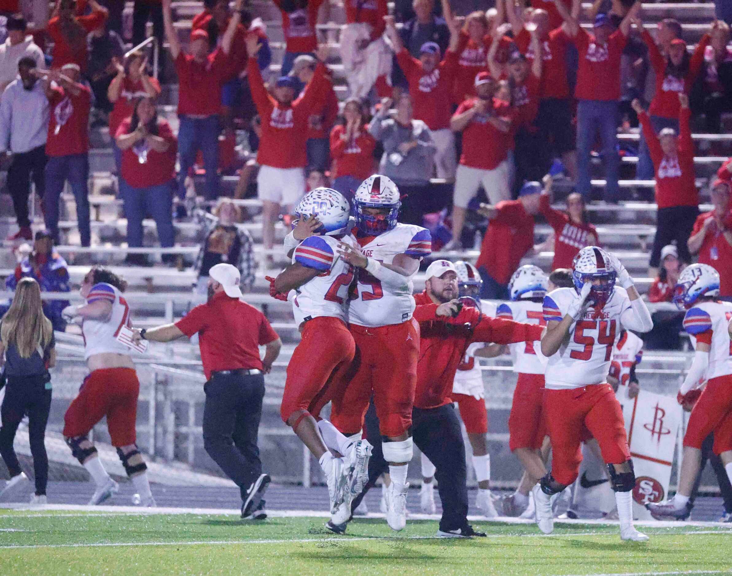 Midlothian Heritage celebrate an intercept during the last minute of the second half of a...