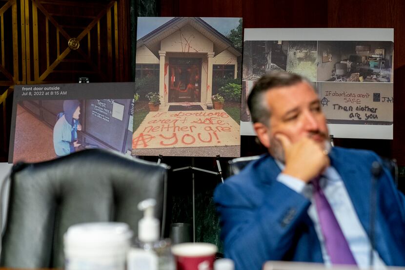 Sen. Ted Cruz, R-Texas, appears in front of images of vandalized anti-abortion pregnancy...