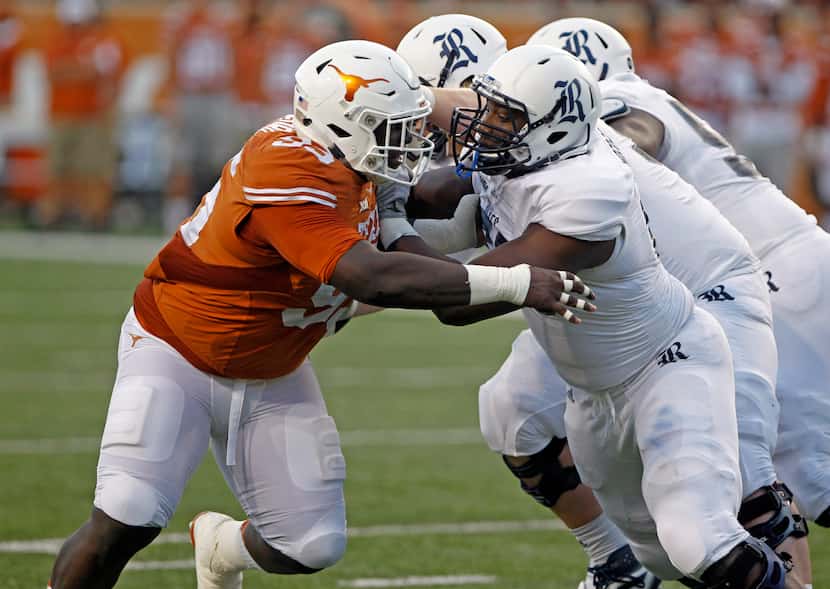 FILE - Texas defensive lineman Poona Food (left) rushes against Rice offensive lineman...