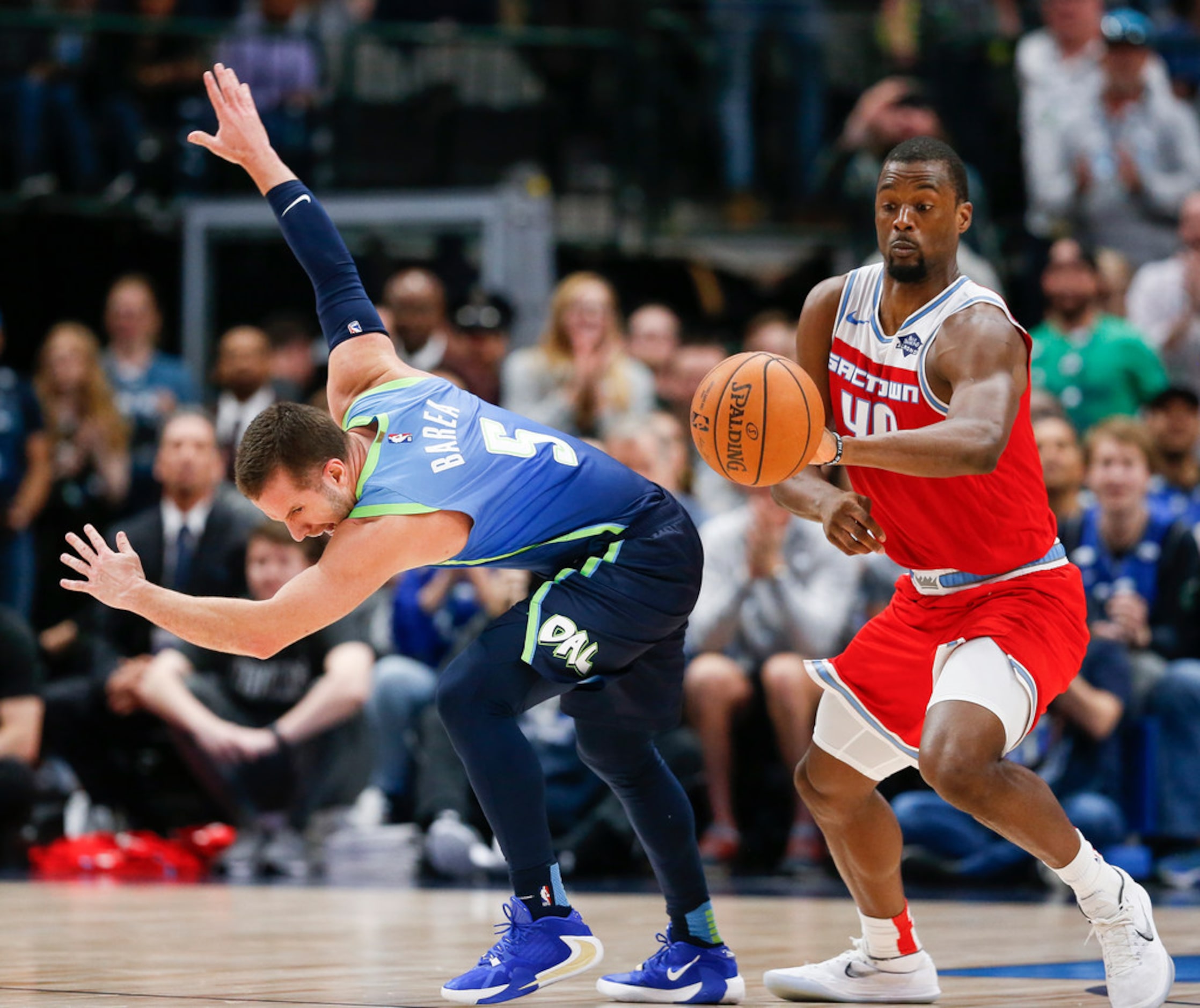 Sacramento Kings forward Harrison Barnes (40) and Dallas Mavericks guard J.J. Barea (5)...