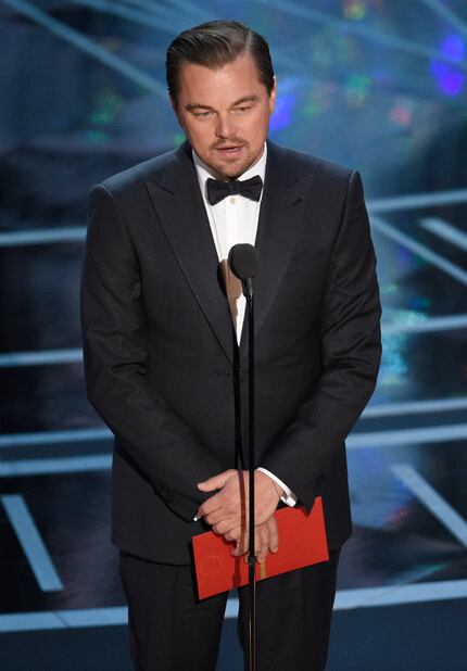 Leonardo DiCaprio presents the award for best actress in a leading role at the Oscars in...