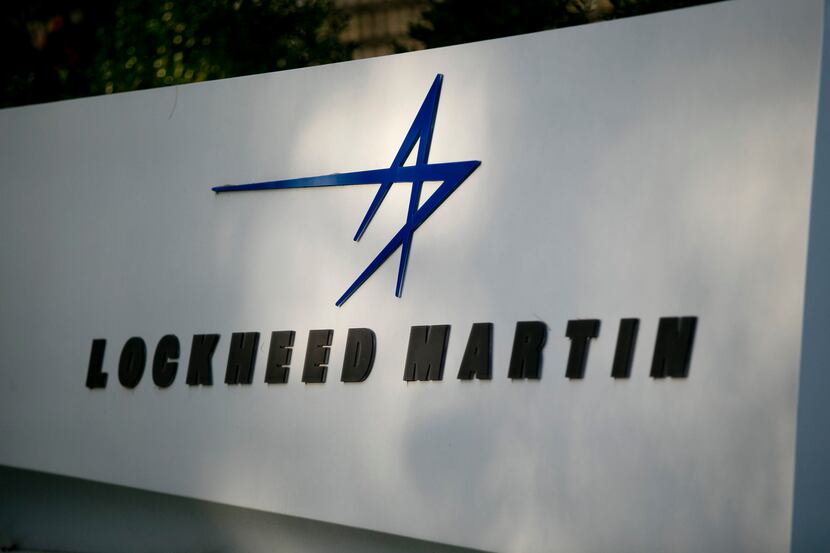 A sign for Lockheed Martin Corp. stands outside the company's headquarters in Bethesda,...