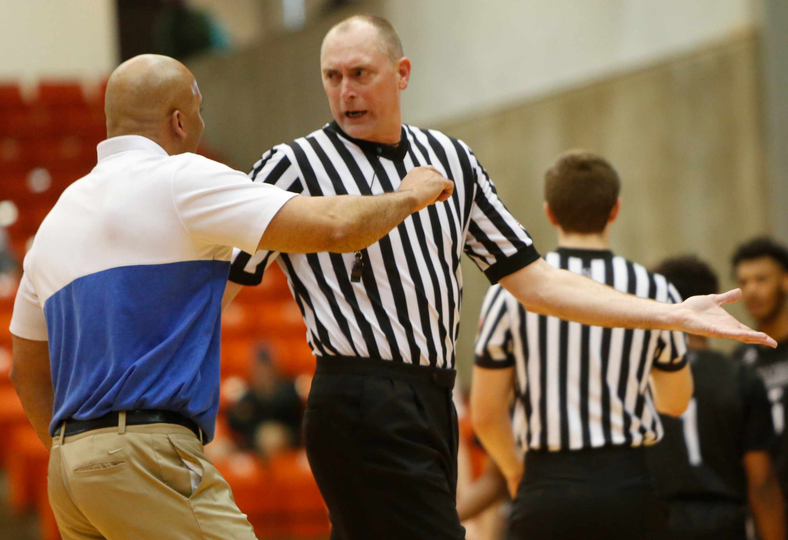 Duncanville head coach David Peavy converses with a game official during a second half...