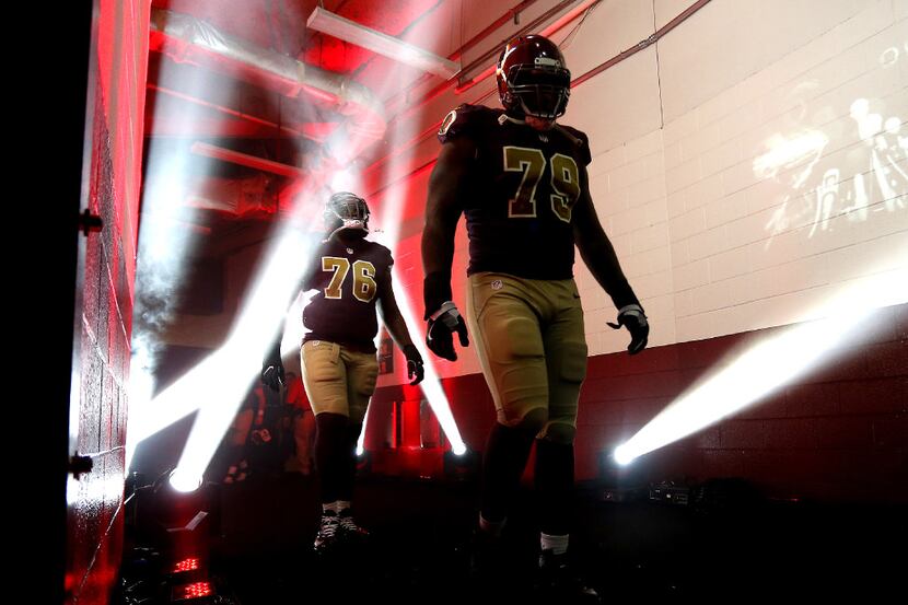 LANDOVER, MD - NOVEMBER 13: Tackle Ty Nsekhe #79 of the Washington Redskins and teammate...