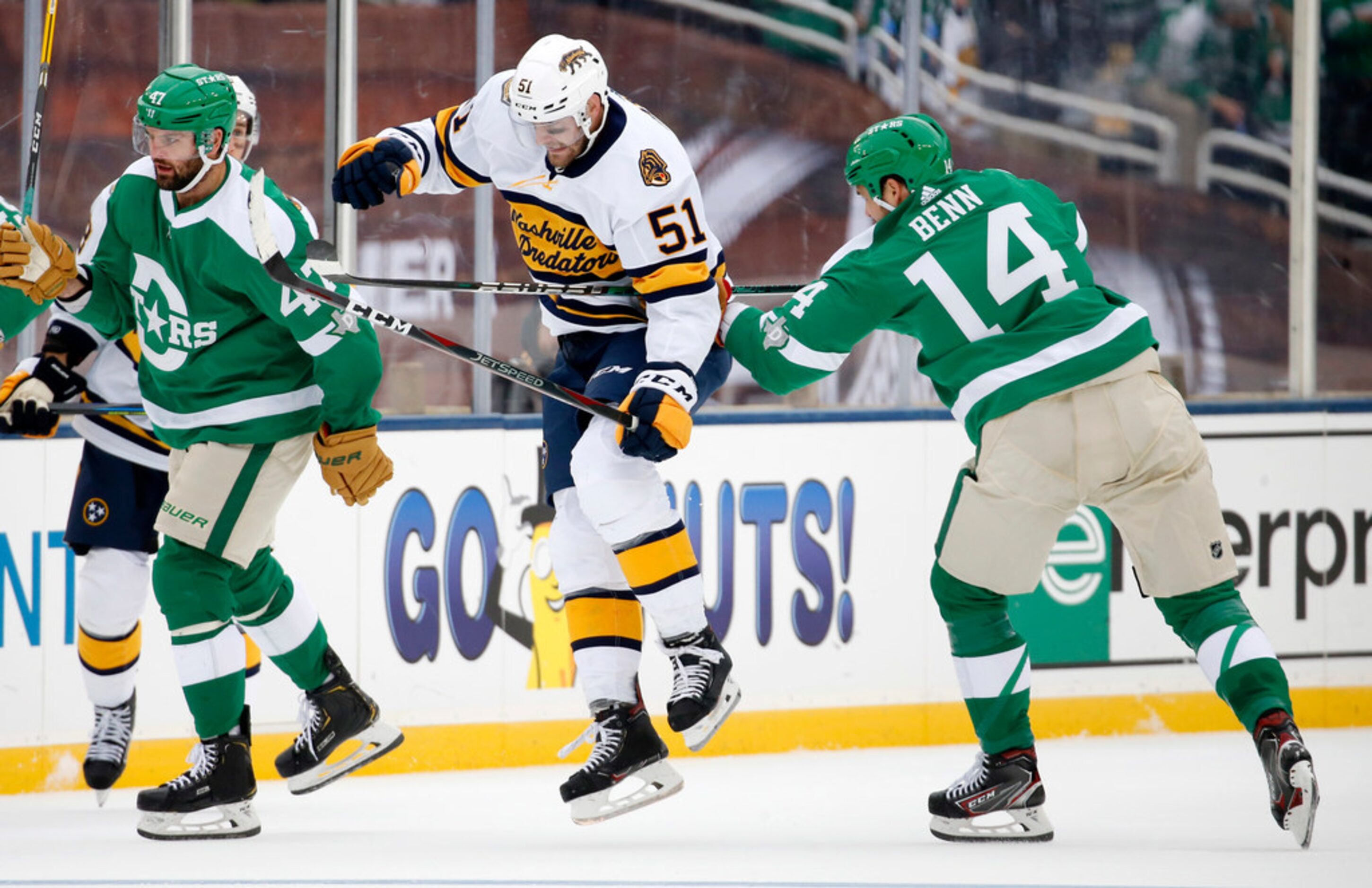 Dallas Stars left wing Jamie Benn (14) slashes  his stick across Nashville Predators left...