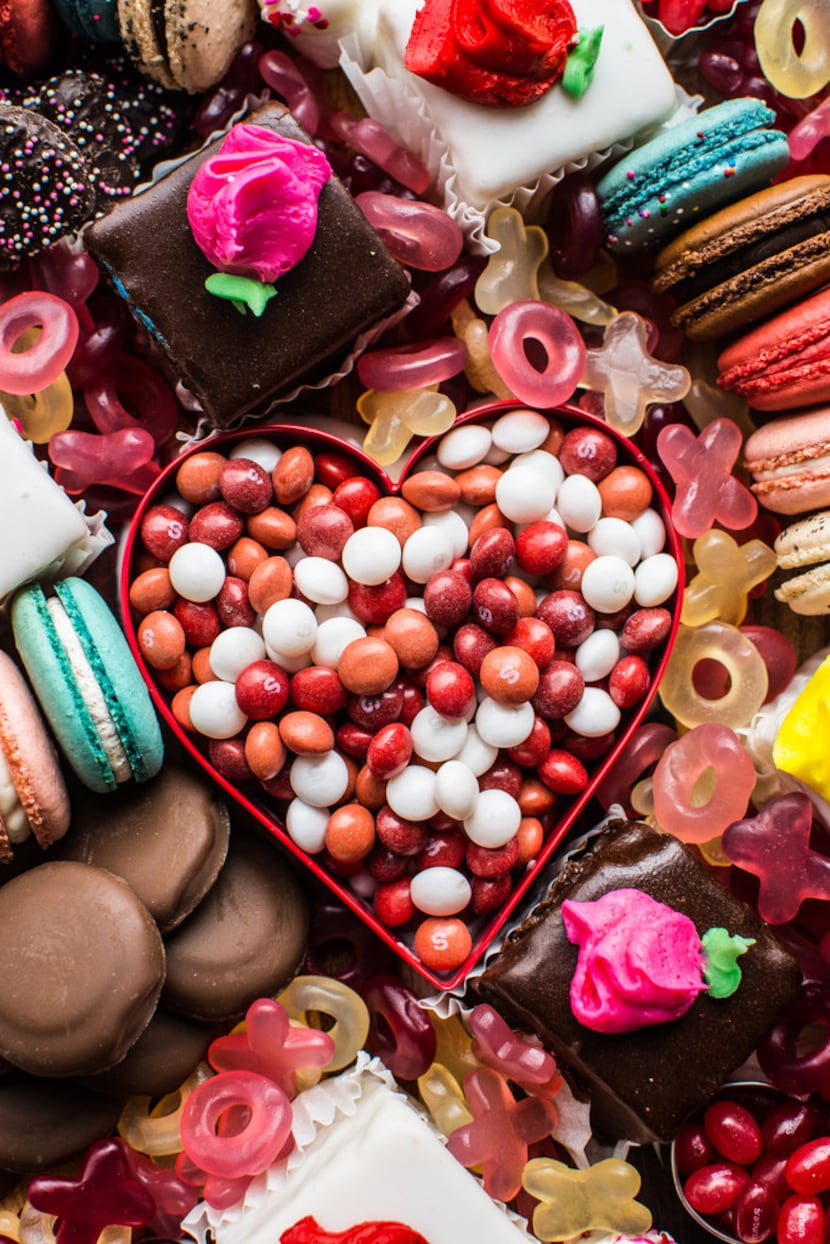 Petit fours, macarons, jelly beans and more comprise a Valentine's Day dessert board