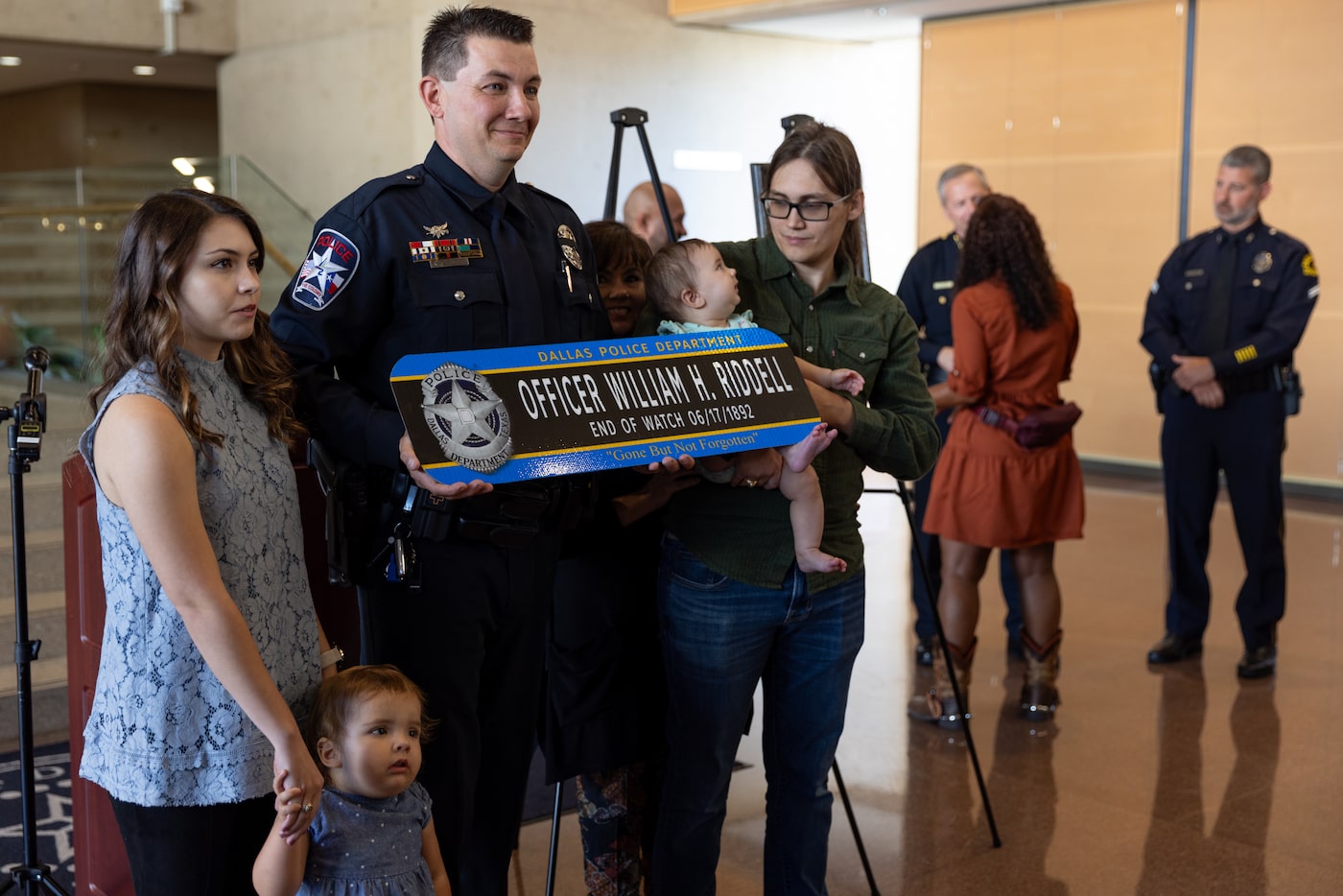 (left to right) Madeline Koiner, Officer Kyle Koiner, Lisa Koiner and David Koiner pose for...