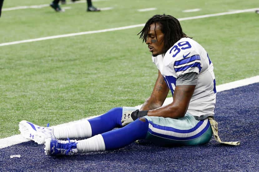 Dallas Cowboys cornerback Brandon Carr (39) sits dejected after losing in overtime at AT&T...