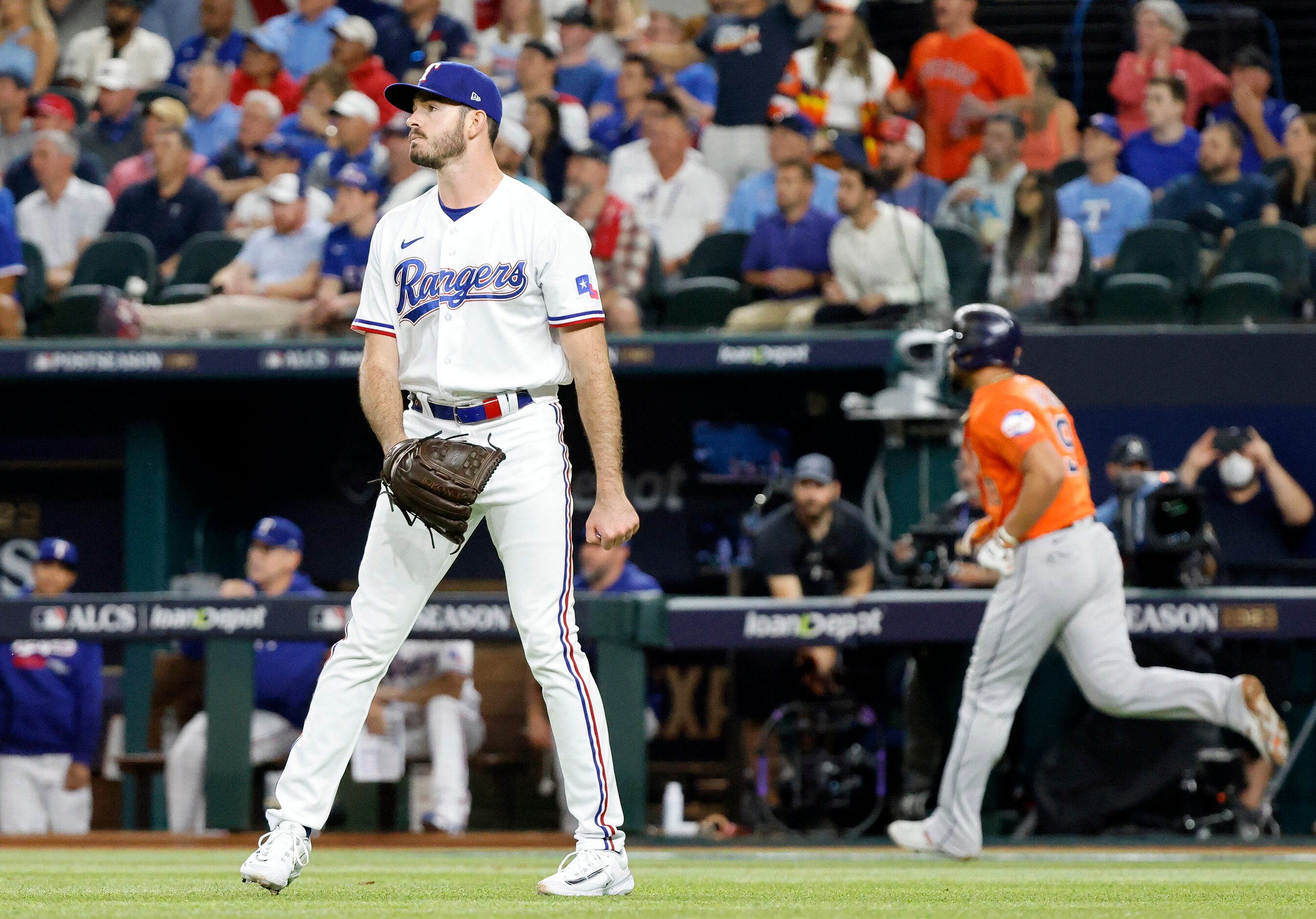 Texas Rangers relief pitcher Cody Bradford (61) watches as Houston Astros Jose Abreu (left)...