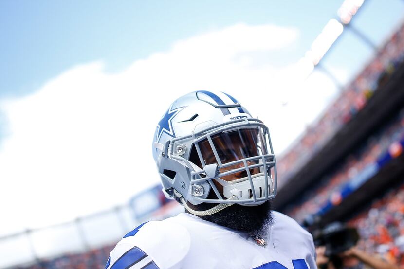 DENVER, CO - SEPTEMBER 17:  Running back Ezekiel Elliott #21 of the Dallas Cowboys stands on...