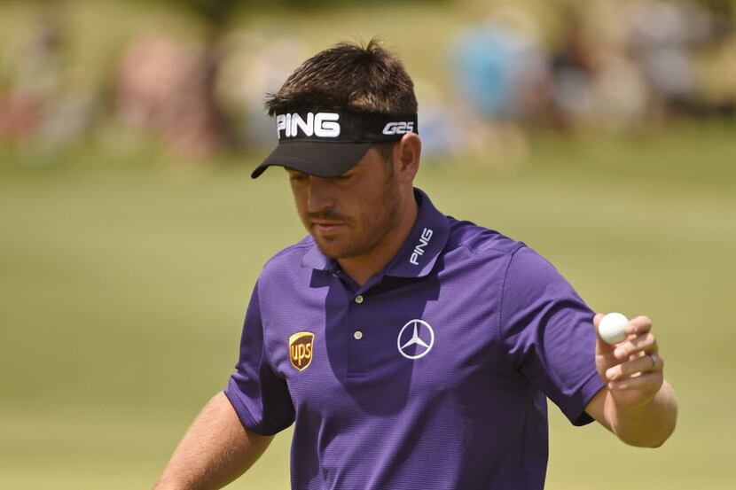 Louis Oosthuizen reacts after making a birdie putt on the 16th hole, during the third round...
