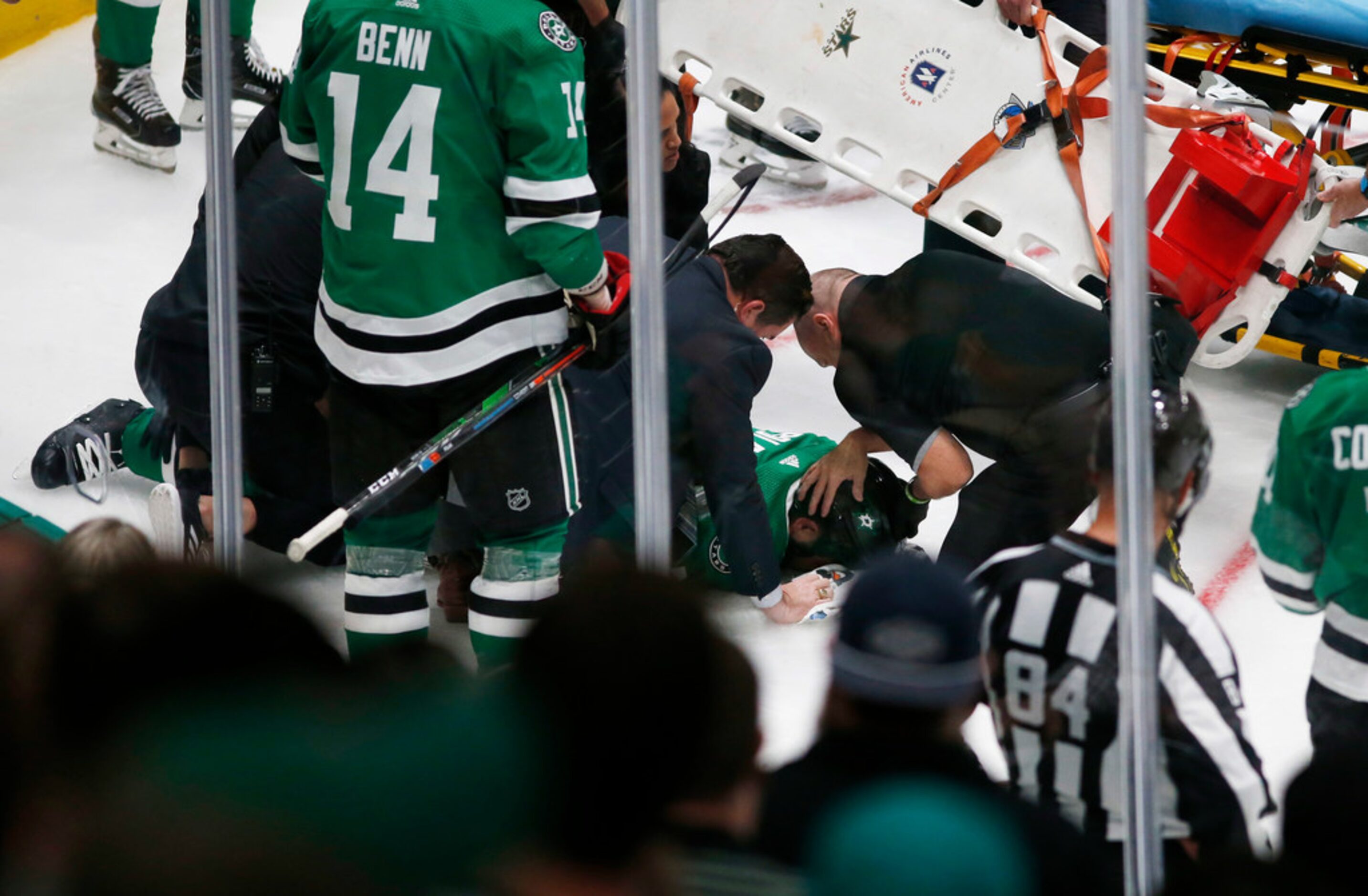 The medical team tends to injured player Dallas Stars defenseman Roman Polak (45) in a game...