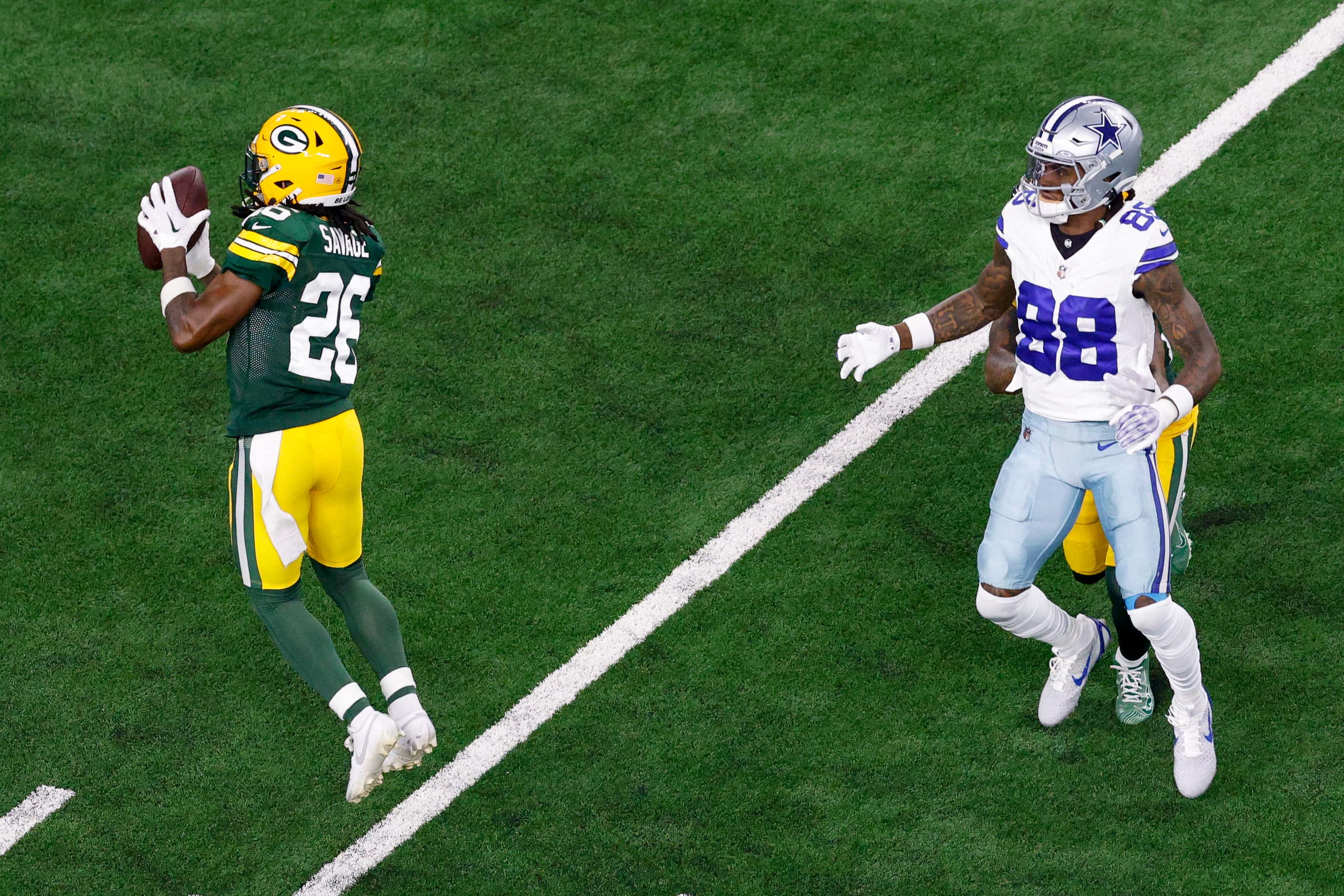 Green Bay Packers safety Darnell Savage (26) intercepts a pass intended for Dallas Cowboys...