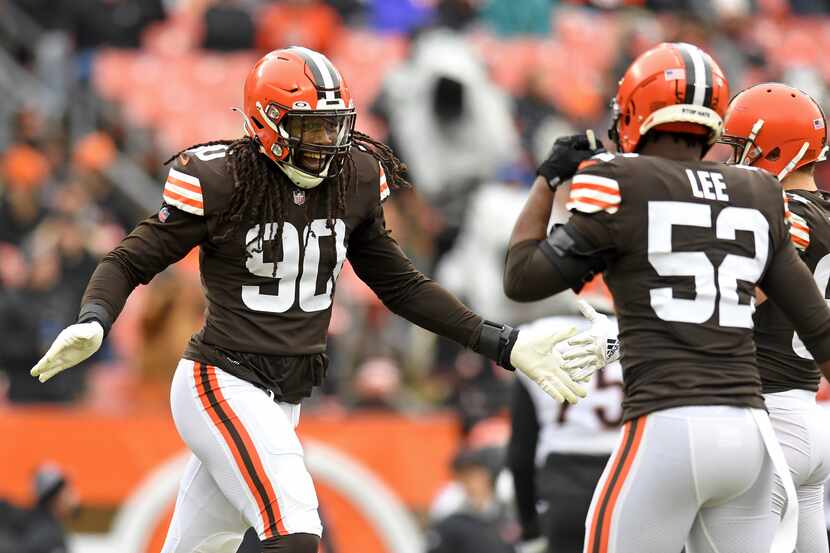 Cleveland Browns defensive end Jadeveon Clowney (90) celebrates a sack in the first half of...