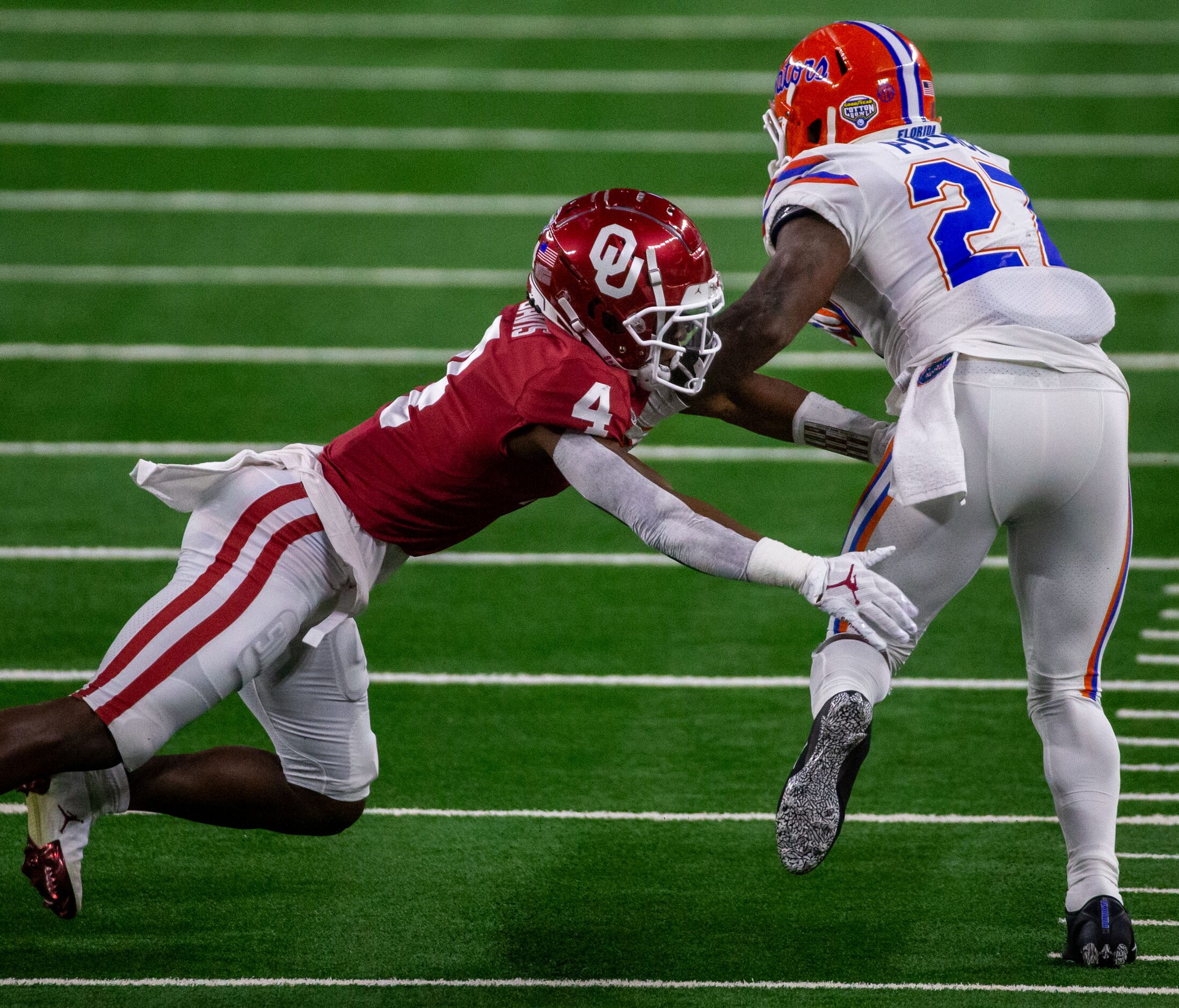 Oklahoma Sooners cornerback Jaden Davis (4) tackles Florida Gators running back Dameon...