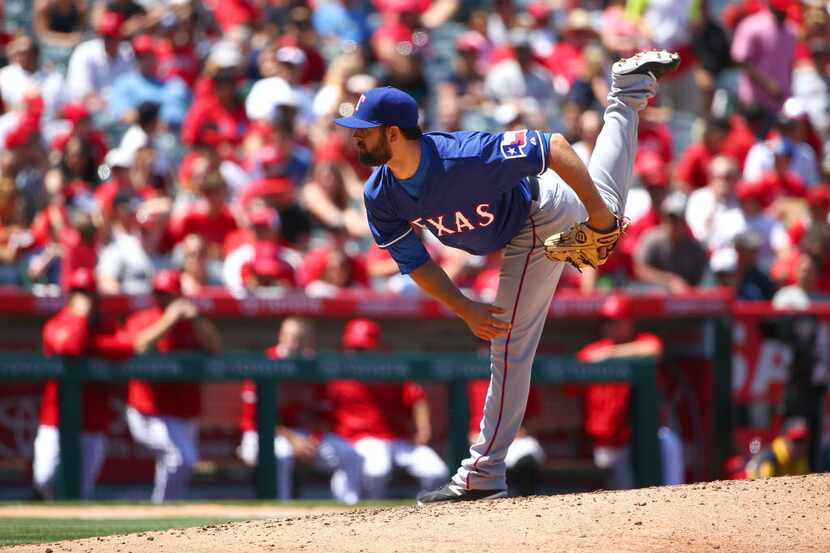 ANAHEIM, CA - APRIL 26: Pitcher Nick Martinez #22 of the Texas Rangers pitches in the fifth...