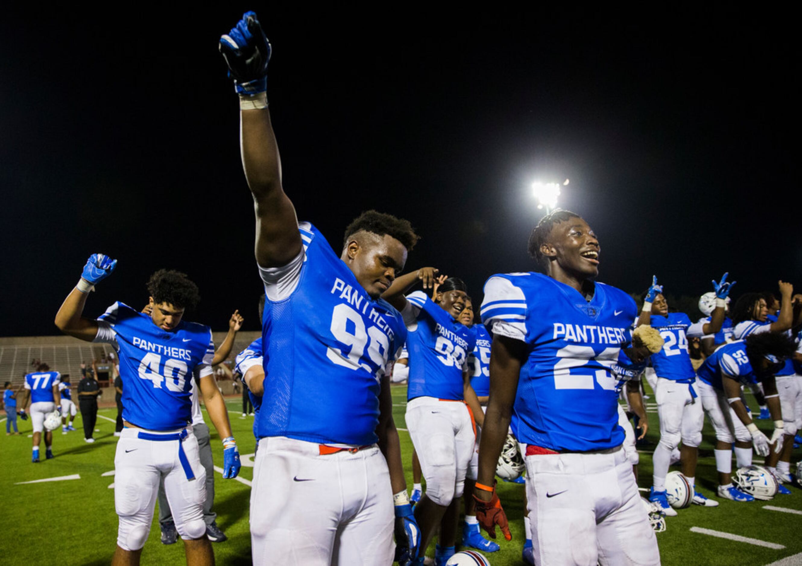 Duncanville defensive lineman Quincy Wright (99) lifts his fist as his team celebrates a...