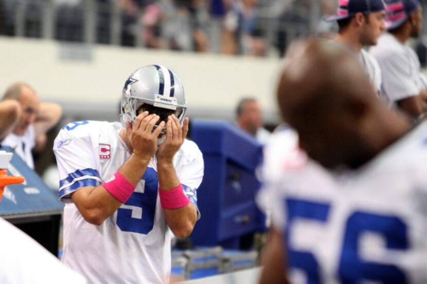 Quarterback Tony Romo hangs he head after failing to get a first down at the end of the game...