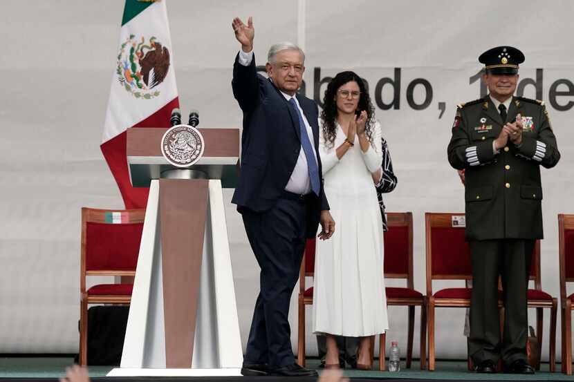 Mexico's President Andres Manuel Lopez Obrador waves to supporters as he arrives to a rally...