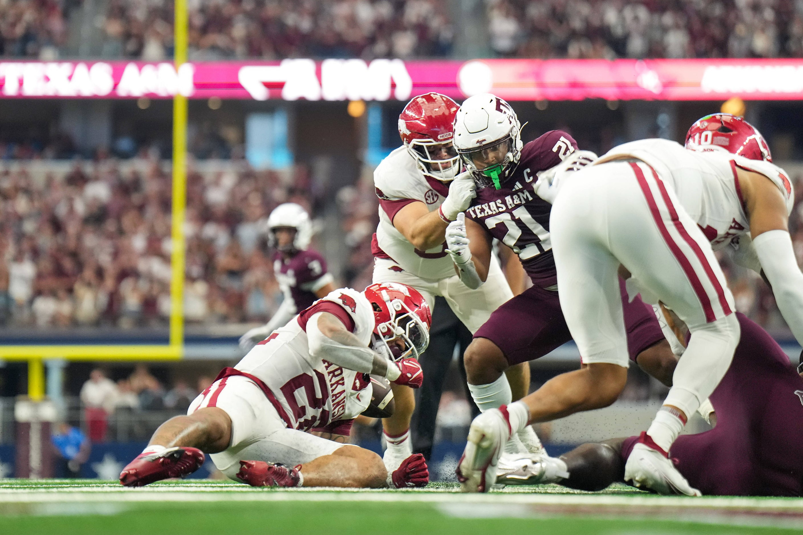 A fumble by Arkansas quarterback Taylen Green (10) gets past running back Ja'Quinden Jackson...