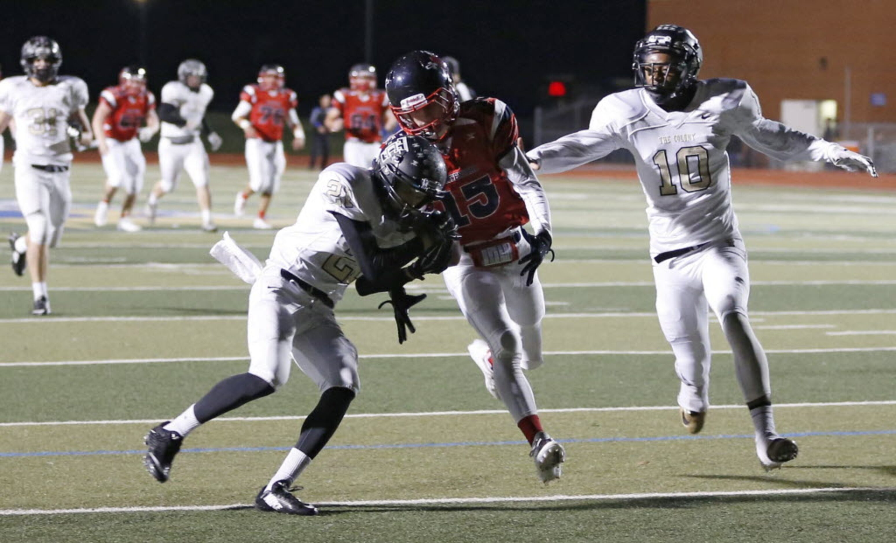 Frisco Centennial's Adam Hoffman (15) can't make the catch as The Colony's Jalen Brown (21)...