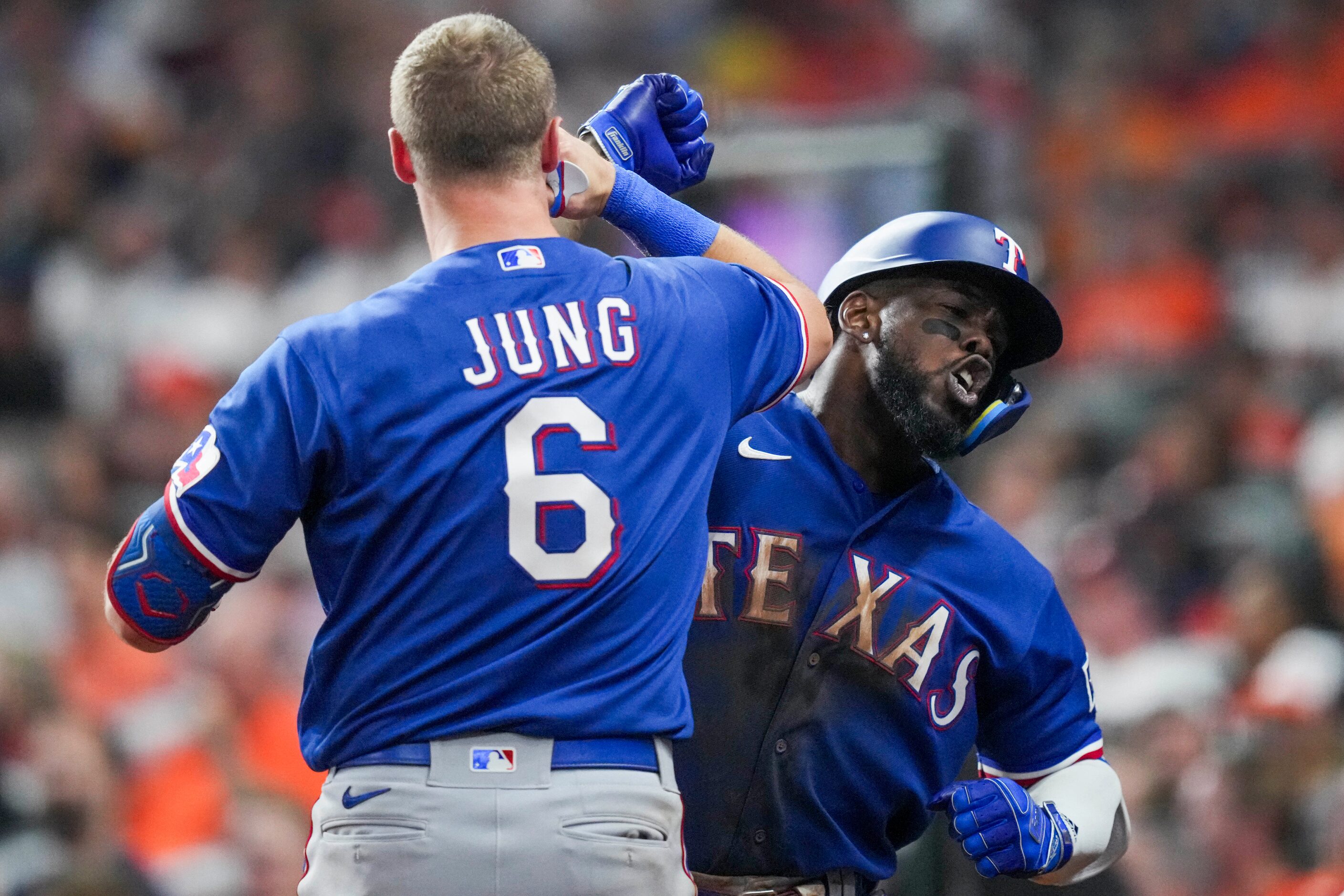 Texas Rangers right fielder Adolis Garcia (53) celebrates with third baseman Josh Jung (6)...