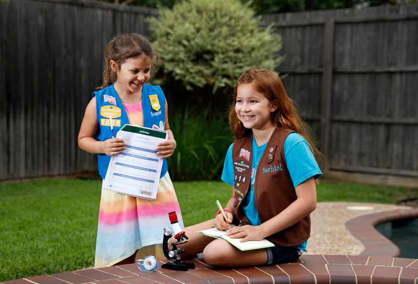 Daisy Scout Bonnie Garcia (left), 6, of Troop 3009 and her sister, Brownie Scout Bechtol...