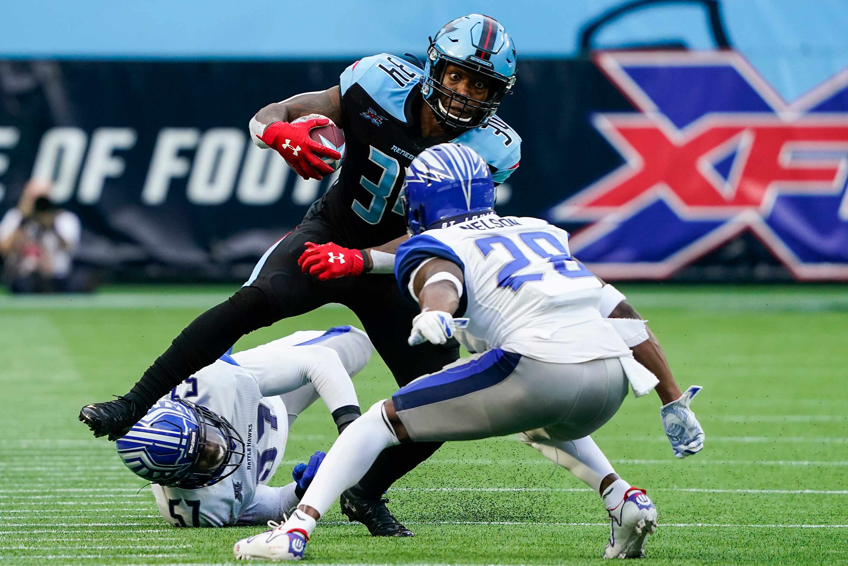 Dallas Renegades running back Cameron Artis-Payne (34) is brought down by St. Louis...