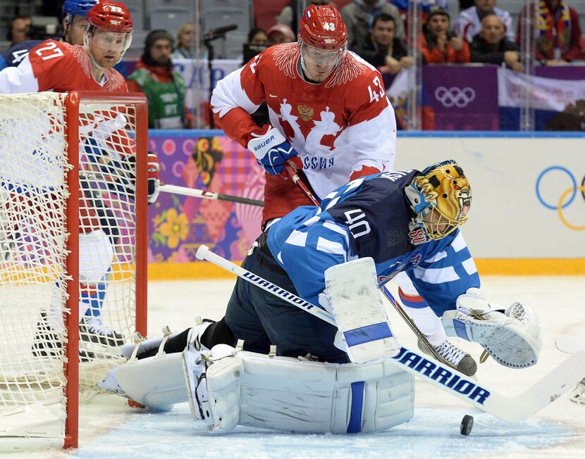 Russia's Valeri Nichushkin attacts Finland's goalkeeper Tuukka Rask (R) during the Men's Ice...