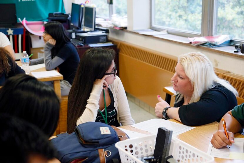 
Teacher Krystal Morrow (right) talks with 10th-grader Alondra Hernandez during an AVID 2...