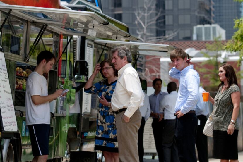 Matt Shasteen (left) takes orders from customers at the Semplice Cibo Italiano food truck...