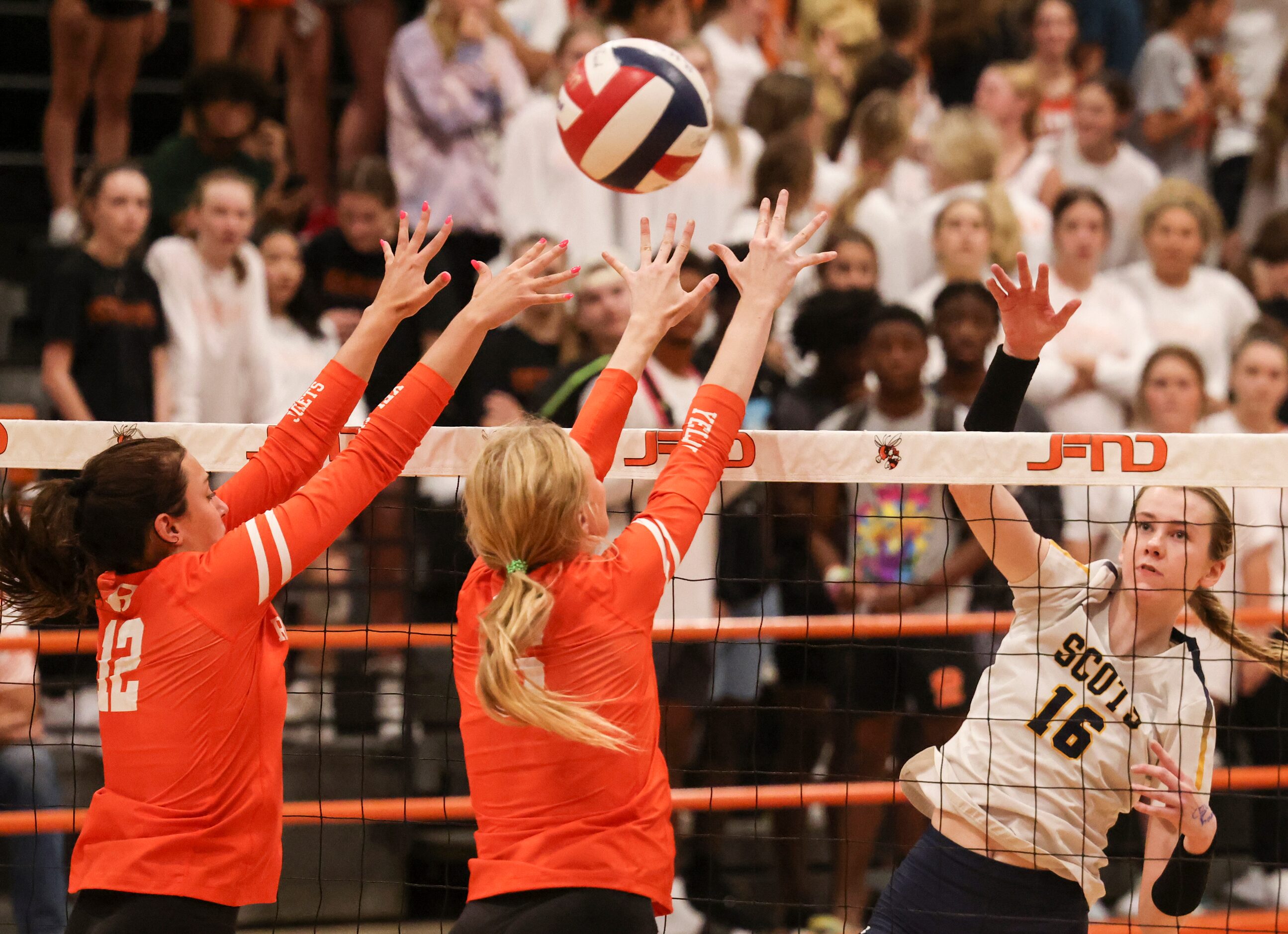 Rockwall High School’s Kiki Carrasco and Claire Lowrey attempt to block a spike from...