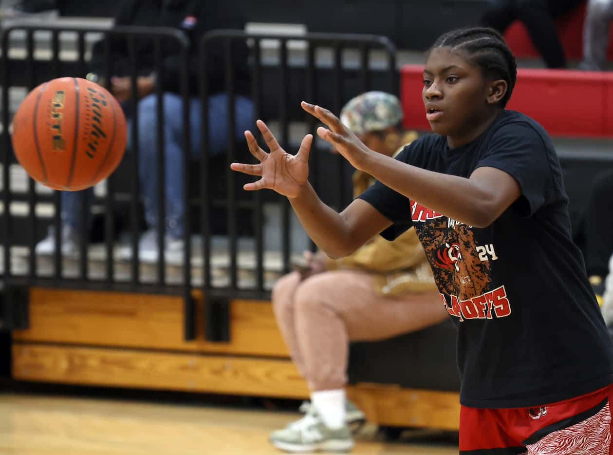 Denton Braswell guard Italy Lewis (24) eyes a passion during team warm-ups prior to the...