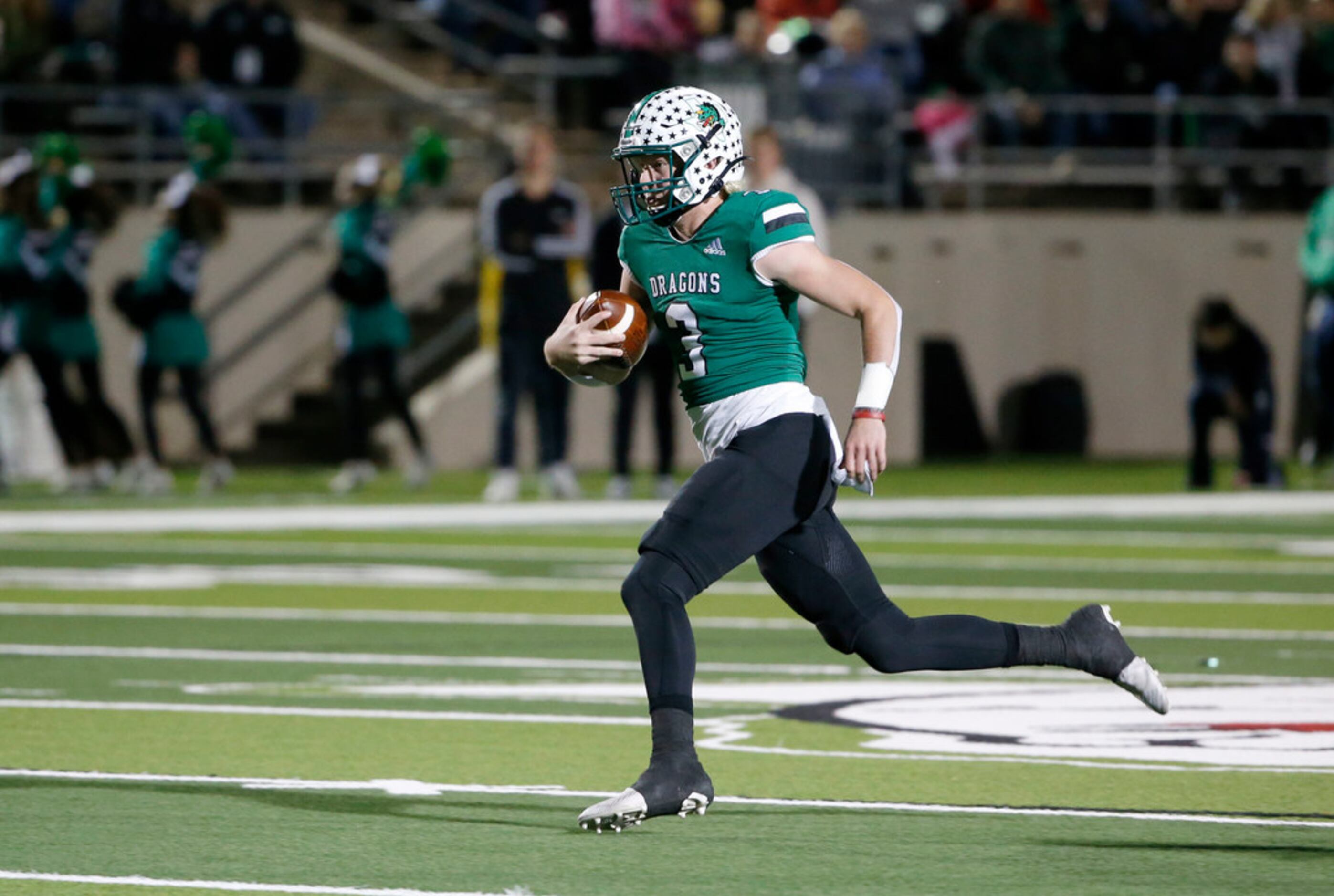 Southlake quarterback Quinn Ewers (3) runs for a first down against Lewisville during the...
