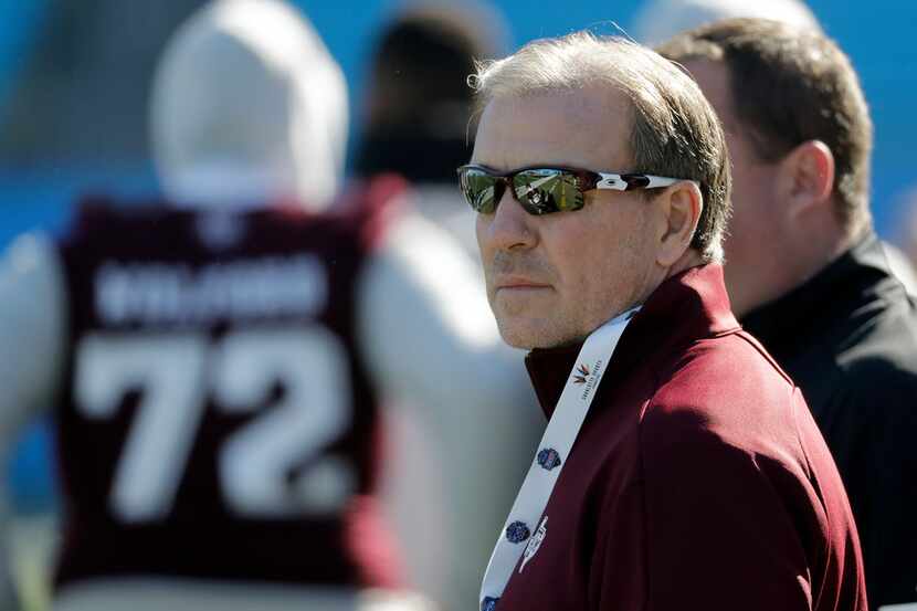Texas A&M head coach Jimbo Fisher watches the Aggies warm up before the Belk Bowl against...