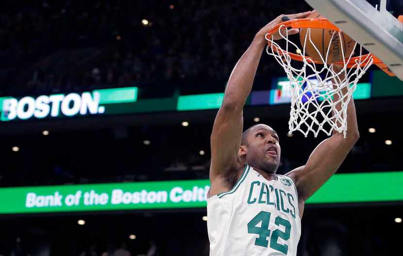 FILE - In this Oct. 30, 2018, file photo, Boston Celtics center Al Horford (42) dunks the...